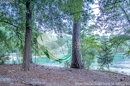 Image of hammock hanging on trees by the lakeside