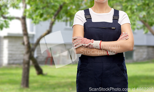 Image of close up of female gardener or builder in overall