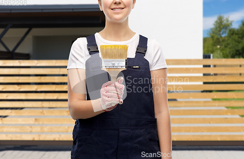 Image of close up of painter or builder with paint brush