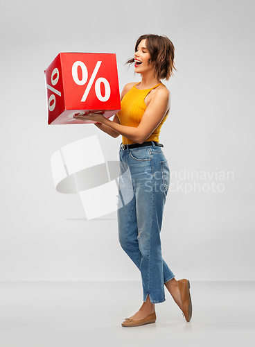 Image of happy smiling young woman with sale sign