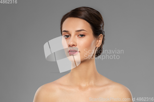 Image of beautiful young woman with bare shoulder