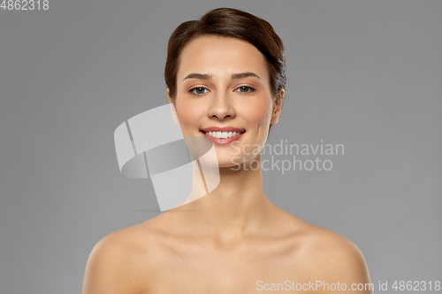Image of beautiful young woman with bare shoulder