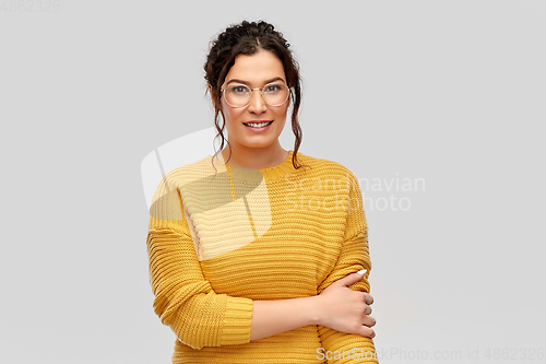 Image of happy smiling young woman in glasses