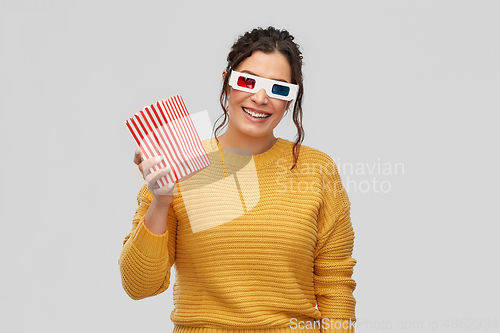 Image of happy woman in 3d movie glasses with popcorn