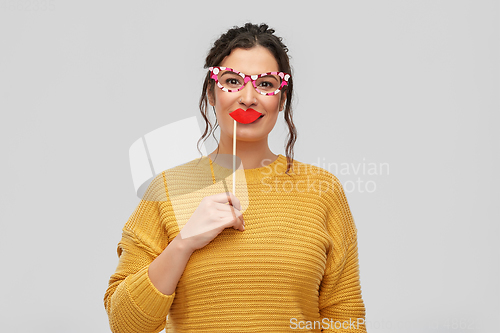 Image of happy young woman with big glasses and lips