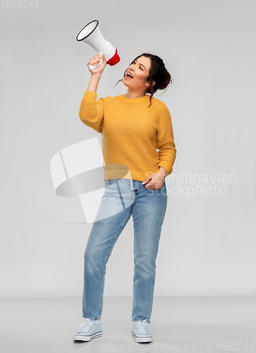 Image of young woman speaking to megaphone