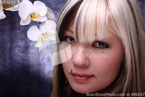 Image of Woman and orchid