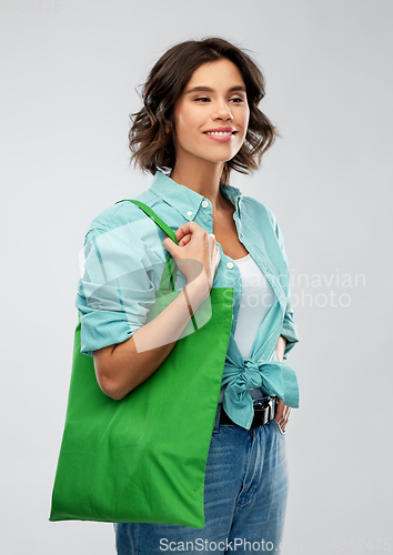 Image of woman with reusable canvas bag for food shopping