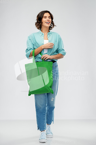 Image of woman with reusable canvas bag for food shopping