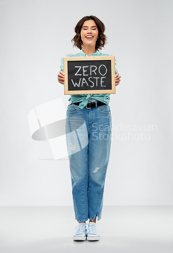 Image of happy woman with chalkboard with zero waste words