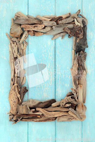 Image of Abstract Driftwood Frame on Rustic Blue Wood