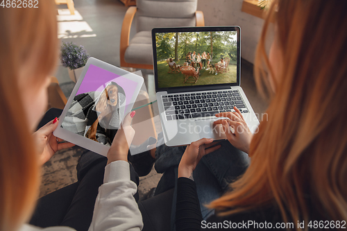 Image of Young friends, women using gadgets to watch cinema, photos, online courses, taking selfie or vlog