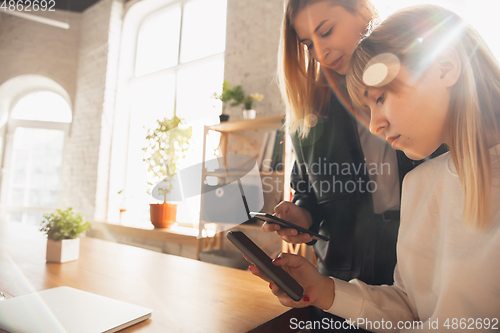 Image of Young friends, women using gadgets to watch cinema, photos, online courses, taking selfie or vlog