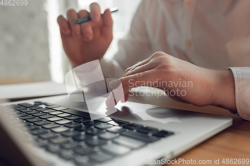 Image of Caucasian young man in business attire working in office, job, online studying