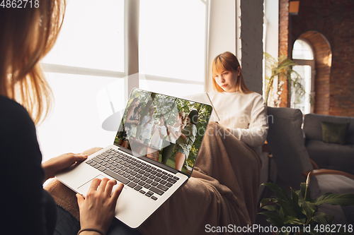 Image of Young friends, women using gadgets to watch cinema, photos, online courses, taking selfie or vlog