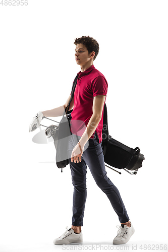 Image of Golf player in a red shirt training, practicing isolated on white studio background