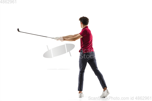 Image of Golf player in a red shirt taking a swing isolated on white studio background