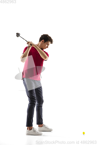 Image of Golf player in a red shirt training, practicing isolated on white studio background