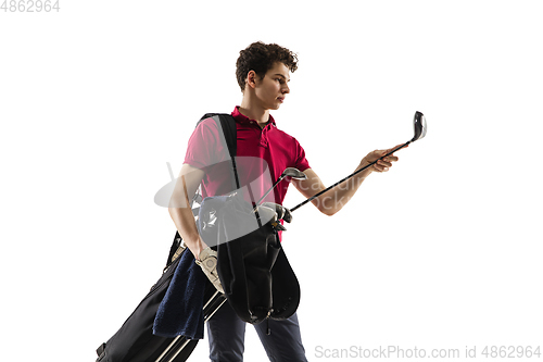 Image of Golf player in a red shirt training, practicing isolated on white studio background