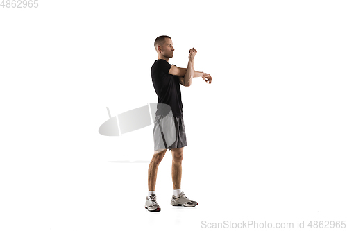 Image of Young caucasian male model in action, motion isolated on white background. Concept of sport, movement, energy and dynamic, healthy lifestyle. Training, practicing.