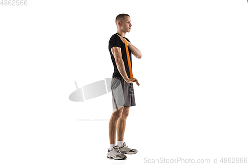 Image of Young caucasian male model in action, motion isolated on white background. Concept of sport, movement, energy and dynamic, healthy lifestyle. Training, practicing.