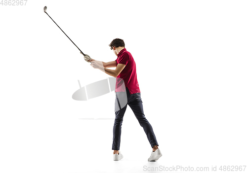 Image of Golf player in a red shirt taking a swing isolated on white studio background