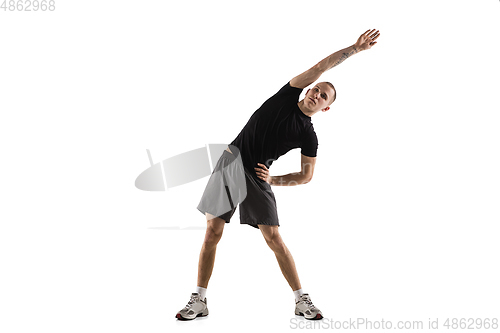 Image of Young caucasian male model in action, motion isolated on white background. Concept of sport, movement, energy and dynamic, healthy lifestyle. Training, practicing.