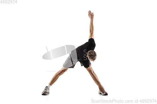 Image of Young caucasian male model in action, motion isolated on white background. Concept of sport, movement, energy and dynamic, healthy lifestyle. Training, practicing.