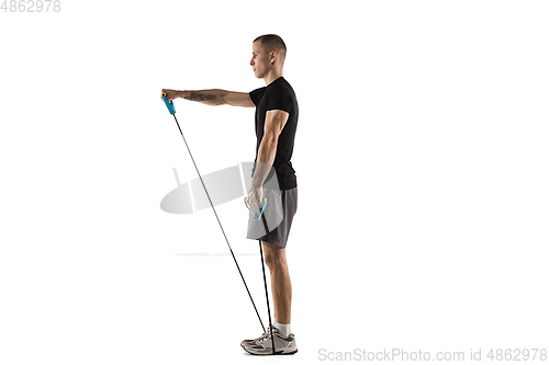 Image of Young caucasian male model in action, motion isolated on white background. Concept of sport, movement, energy and dynamic, healthy lifestyle. Training, practicing.