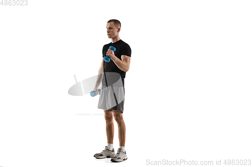 Image of Young caucasian male model in action, motion isolated on white background. Concept of sport, movement, energy and dynamic, healthy lifestyle. Training, practicing.