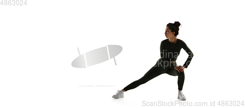 Image of Young caucasian female model in action, motion isolated on white background. Concept of sport, movement, energy and dynamic, healthy lifestyle. Training, practicing.