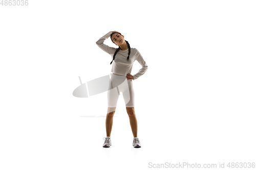 Image of Young caucasian female model in action, motion isolated on white background. Concept of sport, movement, energy and dynamic, healthy lifestyle. Training, practicing.