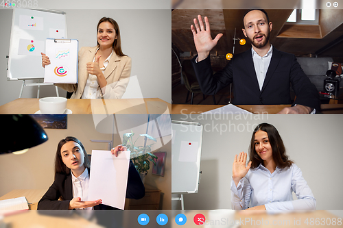 Image of Young colleagues talking, working in videoconference with co-workers at office or living room. Online business, education during quarantine.