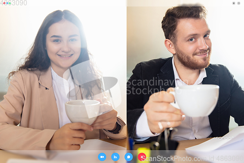 Image of Young colleaugues talking, working in videoconference with co-workers at office or living room. Online business, education during quarantine.