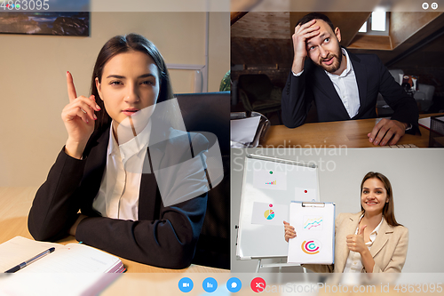 Image of Young colleagues talking, working in videoconference with co-workers at office or living room. Online business, education during quarantine.