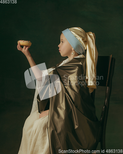 Image of Medieval little girl as a lady with a pearl earring on dark studio background. Concept of comparison of eras, childhood. Stylish creative design, art vision, new look of artwork.