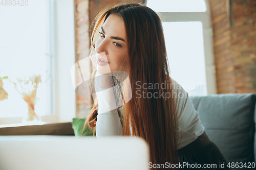Image of Caucasian woman singing during online concert at home isolated and quarantined, impressive improvising, close up
