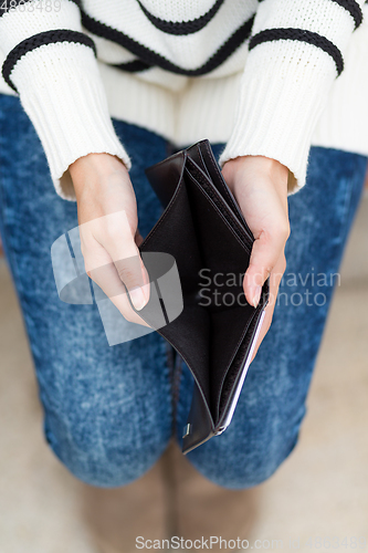Image of Woman with an empty wallet