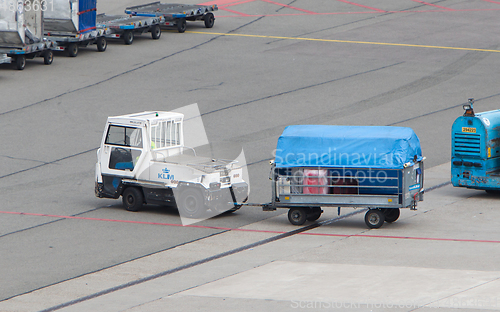 Image of AMSTERDAM - JUNE 29, 2017: Planes are being loaded at Schiphol A