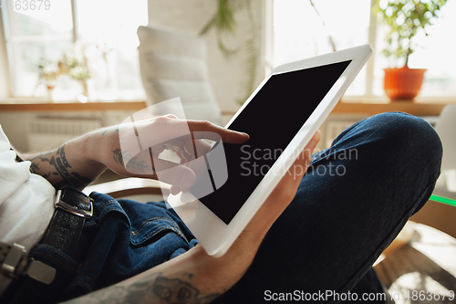 Image of Close up of male hands using tablet with blank screen, copyspace, education and business concept