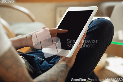 Image of Close up of male hands using tablet with blank screen, copyspace, education and business concept