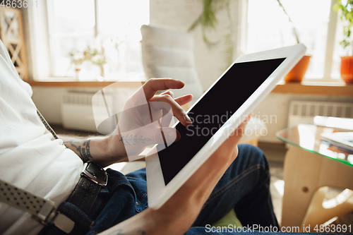 Image of Close up of male hands using tablet with blank screen, copyspace, education and business concept