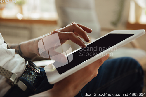 Image of Close up of male hands using tablet with blank screen, copyspace, education and business concept