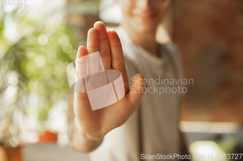 Image of Close up of male hand showing sign of stoping, rejectioning