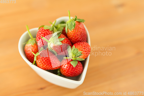 Image of Fresh Strawberry in heart shape bowl