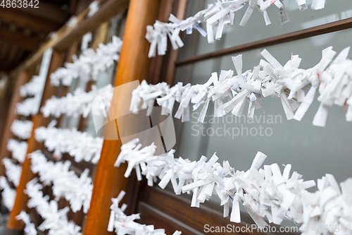 Image of Fortune teller paper strip in Japanese temple