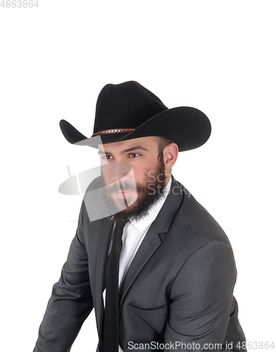 Image of Portrait of man in a suit and cowboy hat