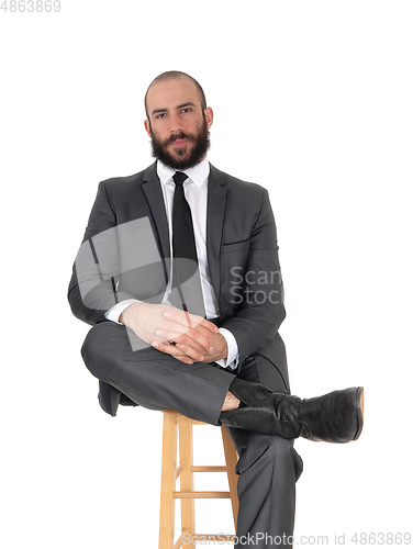Image of Relaxing business man sitting on a chair