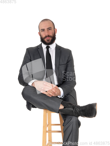 Image of Relaxing business man sitting on a chair
