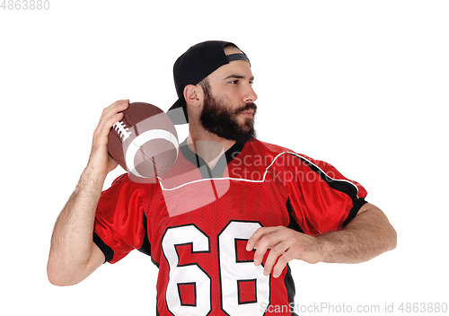 Image of Closeup of a football player with his football in his hand